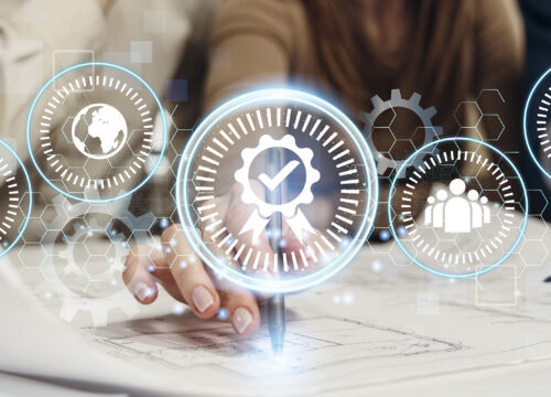 Hand pointing at a certification badge digital icon surrounded by ISO management standard symbols in a professional setting.