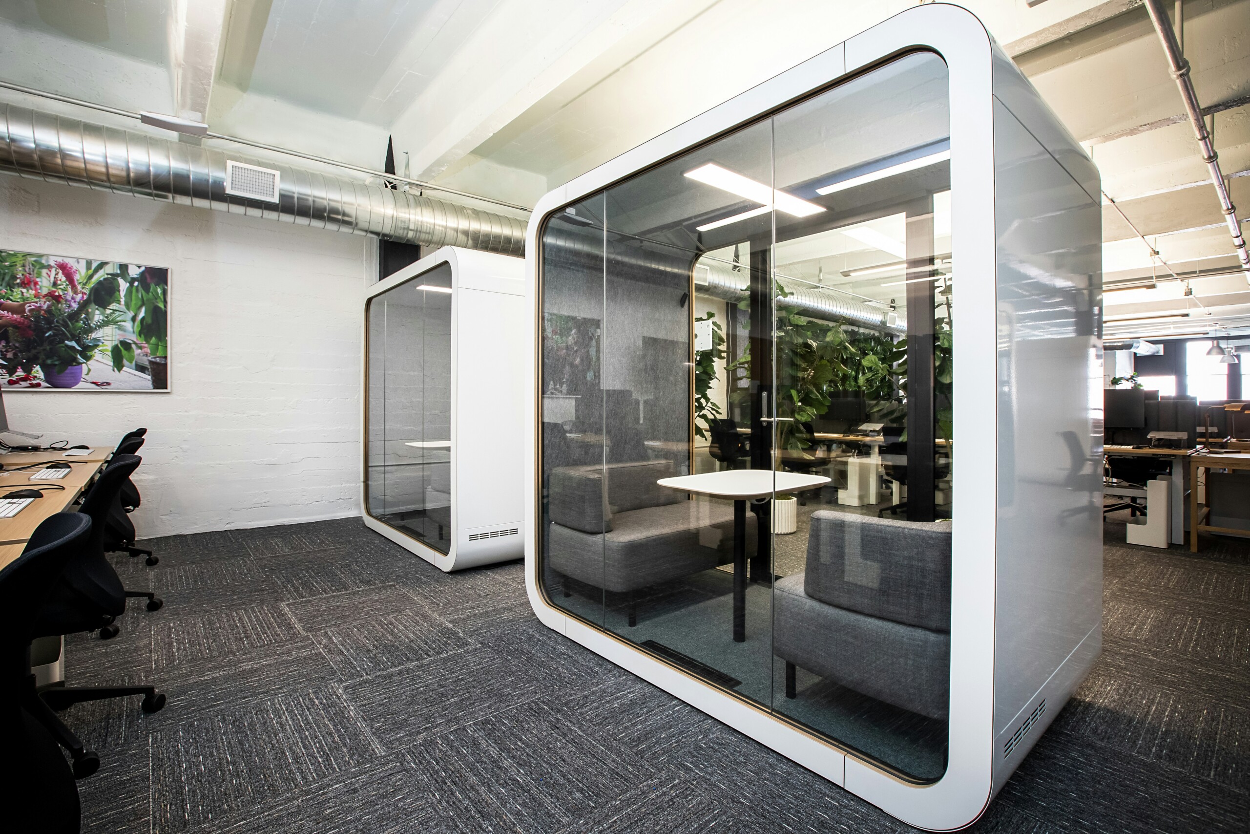 Modern coworking space with phone booth pods