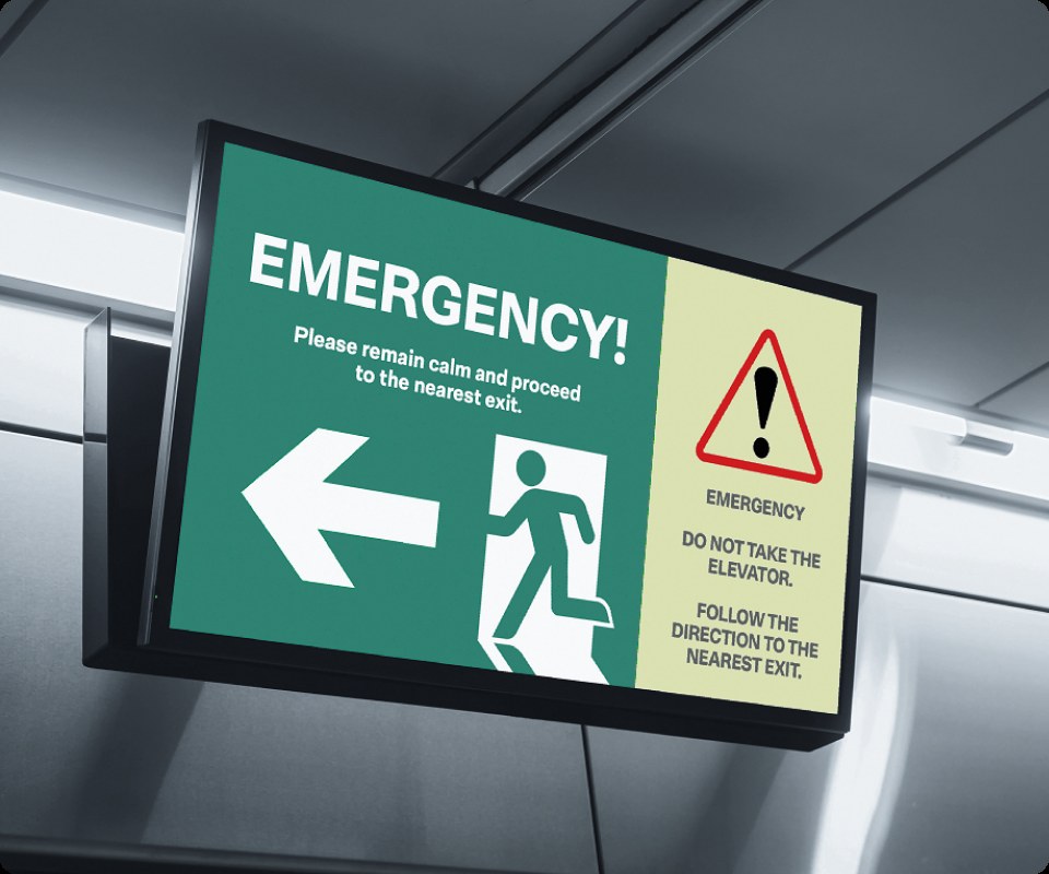 Large Joan screen showing an emergency evacuation alert with exit directions.