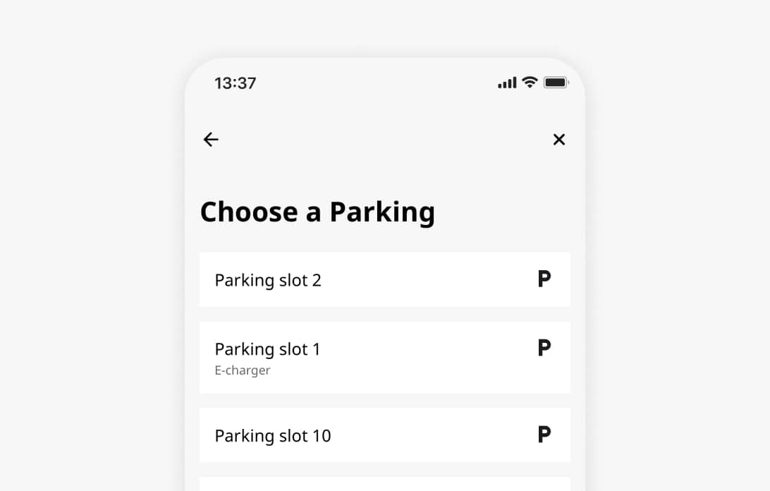 MyJoan mobile app screen showing a parking slot selection menu with options including an E-charger spot.